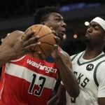
              Washington Wizards' Thomas Bryant (13) is fouled by Milwaukee Bucks' Bobby Portis during the first half of an NBA basketball game Tuesday, Feb. 1, 2022, in Milwaukee. (AP Photo/Aaron Gash)
            