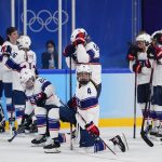 
              The United States team watches as Canada players celebrate after winning the women's gold medal hockey game at the 2022 Winter Olympics, Thursday, Feb. 17, 2022, in Beijing. (AP Photo/Matt Slocum)
            