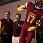 
              Dan Snyder, right, co-owner and co-CEO of the Washington Commanders, poses for photos with former quarterback Joe Theismann during an event to unveil the NFL football team's new identity, Wednesday, Feb. 2, 2022, in Landover, Md. The new name comes 18 months after the once-storied franchise dropped its old moniker following decades of criticism that it was offensive to Native Americans. (AP Photo/Patrick Semansky)
            