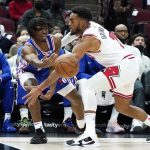 
              Philadelphia 76ers guard Tyrese Maxey, left, passes the ball against Chicago Bulls forward Troy Brown Jr., during the first half of an NBA basketball game in Chicago, Sunday, Feb. 6, 2022. (AP Photo/Nam Y. Huh)
            