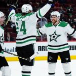 
              Dallas Stars center Roope Hintz (24) celebrates his goal against the Arizona Coyotes with Stars center Joe Pavelski, right, and Stars defenseman Ryan Suter (20) during the second period of an NHL hockey game Sunday, Feb. 20, 2022, in Glendale, Ariz. (AP Photo/Ross D. Franklin)
            