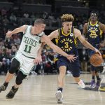 
              Indiana Pacers guard Chris Duarte (3) drives past Boston Celtics guard Payton Pritchard (11) during the first half of an NBA basketball game, Sunday, Feb. 27, 2022, in Indianapolis. (AP Photo/Darron Cummings)
            