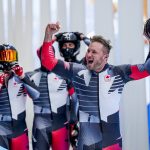 
              Justin Kripps, Ryan Sommer, Cam Stones and Benjamin Coakwell, of Canada, celebrate after the 4-man heat 4 at the 2022 Winter Olympics, Sunday, Feb. 20, 2022, in the Yanqing district of Beijing. (AP Photo/Pavel Golovkin)
            