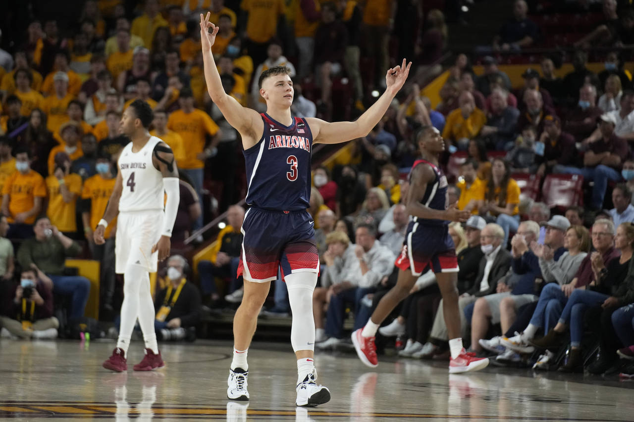 Arizona guard Pelle Larsson (3) reacts after scoring against Arizona State during the second half o...