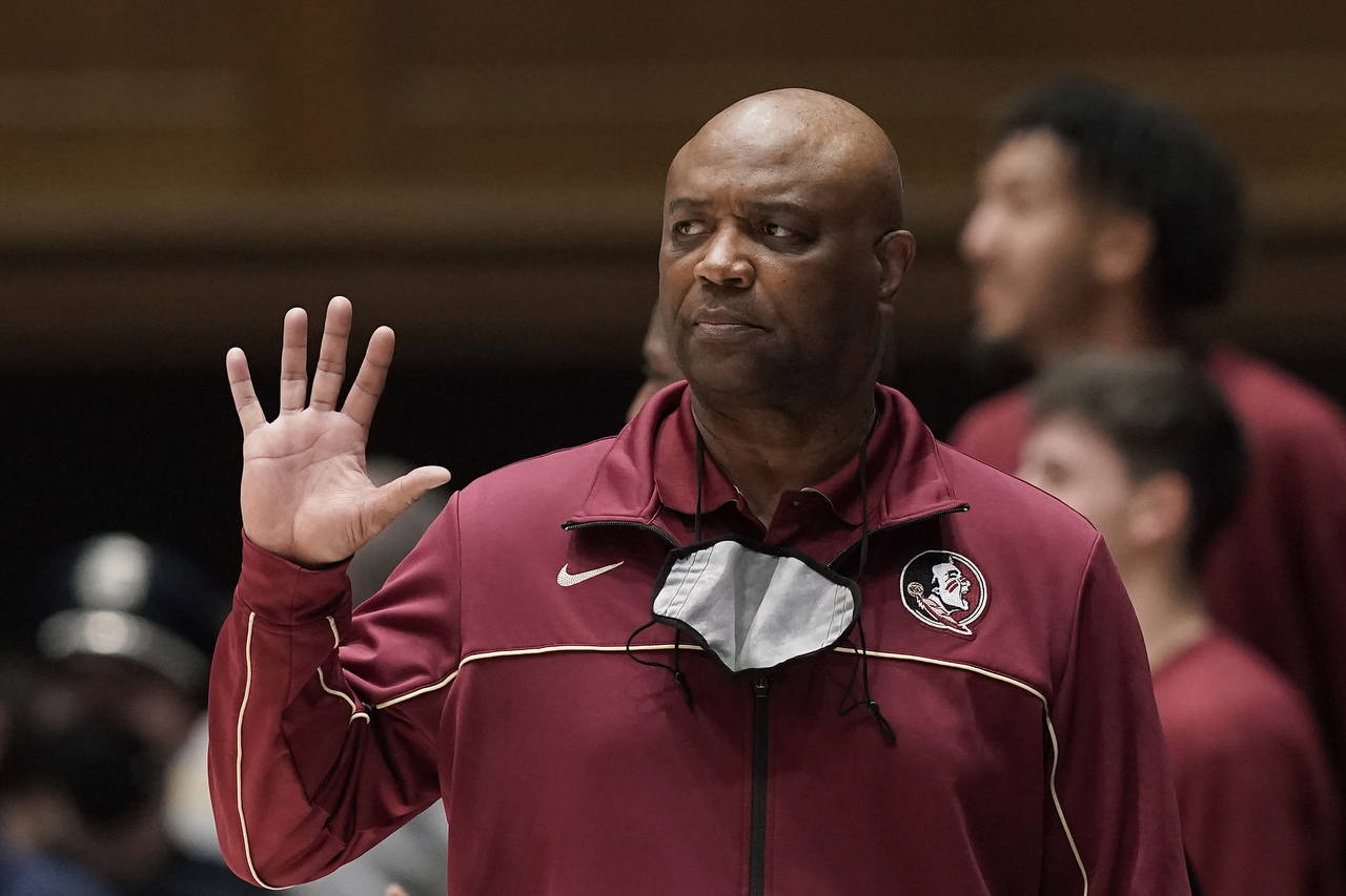 Florida State coach Leonard Hamilton signals to the team during the second half of an NCAA college ...