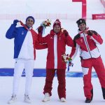 
              Beat Feuz, of Switzerland, gold, center, Johan Clarey, of France, silver, left, and Matthias Mayer, of Austria, bronze, react during the medal ceremony for the men's downhill at the 2022 Winter Olympics, Monday, Feb. 7, 2022, in the Yanqing district of Beijing.(AP Photo/Luca Bruno)
            