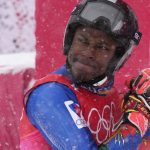 
              Richardson Viano, of Haiti reacts after finishing the first run of the men's giant slalom at the 2022 Winter Olympics, Sunday, Feb. 13, 2022, in the Yanqing district of Beijing. (AP Photo/Luca Bruno)
            