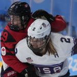 
              Canada's Marie-Philip Poulin collides United States' Lee Stecklein during the women's gold medal hockey game at the 2022 Winter Olympics, Thursday, Feb. 17, 2022, in Beijing. (AP Photo/Petr David Josek)
            