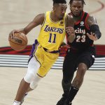 
              Los Angeles Lakers guard Malik Monk, left, drives as Portland Trail Blazers guard Ben McLemore defends during the first half of an NBA basketball game in Portland, Ore., Wednesday, Feb. 9, 2022. (AP Photo/Steve Dipaola)
            
