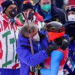 
              Federica Brignone of Italy is congratulated by teammates after winning the silver medal during the women's giant slalom at the 2022 Winter Olympics, Monday, Feb. 7, 2022, in the Yanqing district of Beijing.(AP Photo/Mark Schiefelbein)
            