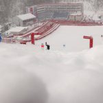 
              Workers clear snow from the course after the second run of the men's giant slalom was delayed due to a heavy snowfall at the 2022 Winter Olympics, Sunday, Feb. 13, 2022, in the Yanqing district of Beijing. (AP Photo/Alessandro Trovati)
            
