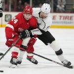 
              Detroit Red Wings center Pius Suter (24) and Los Angeles Kings center Adrian Kempe (9) battle for the puck in the first period of an NHL hockey game Wednesday, Feb. 2, 2022, in Detroit. (AP Photo/Paul Sancya)
            