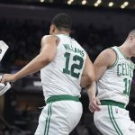 
              Boston Celtics guard Payton Pritchard (11) and Grant Williams (12) celebrate a basket by Pritchard during the first half of an NBA basketball game, Sunday, Feb. 27, 2022, in Indianapolis. (AP Photo/Darron Cummings)
            