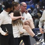 
              Villanova's Lior Garzon (12) is carried off the court after injuring herself during her team's celebration at the end of an NCAA college basketball game against Connecticut, Wednesday, Feb. 9, 2022, in Hartford, Conn. (AP Photo/Jessica Hill)
            