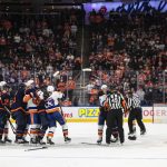 
              New York Islanders and the Edmonton Oilers rough it up at the end of an NHL hockey game Friday, Feb. 11, 2022, in Edmonton, Alberta. (Jason Franson/The Canadian Press via AP)
            