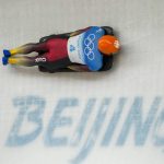 
              Christopher Grotheer, of Germany, slides during men's skeleton run 1 at the 2022 Winter Olympics, Thursday, Feb. 10, 2022, in the Yanqing district of Beijing. (AP Photo/Dmitri Lovetsky)
            