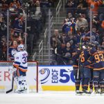 
              New York Islanders goalie Ilya Sorokin (30) waits as the Edmonton Oilers players celebrate a goal during the third period of an NHL hockey game Friday, Feb. 11, 2022, in Edmonton, Alberta. (Jason Franson/The Canadian Press via AP)
            