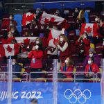 
              Fans for Team Canada cheer during the women's gold medal hockey game between Canada and the United States at the 2022 Winter Olympics, Thursday, Feb. 17, 2022, in Beijing. (AP Photo/Matt Slocum)
            