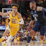 
              Minnesota guard Eylijah Stephens (20) drives past Penn State guard Myles Dread (2) during the first half an NCAA college basketball game Saturday Feb. 12, 2022, in Minneapolis. (AP Photo/Craig Lassig)
            