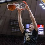 
              Purdue center Zach Edey (15) dunks the ball during the second half of an NCAA college basketball game against Illinois, Tuesday, Feb. 8, 2022, in West Lafayette, Ind. (AP Photo/Doug McSchooler)
            