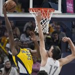
              Indiana Pacers' Jalen Smith (25) dunks against Oklahoma City Thunder's Aleksej Pokusevski during the first half of an NBA basketball game Friday, Feb. 25, 2022, in Indianapolis. (AP Photo/Darron Cummings)
            