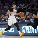 
              Brooklyn Nets guard Seth Curry dribbles up the court during the first half of an NBA basketball game against the New York Knicks, Wednesday, Feb. 16, 2022, in New York. (AP Photo/John Minchillo)
            