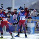 
              Tiril Eckhoff of Norway (6) and Marte Olsbu Roeiseland of Norway (2) arrive at the shooting range during the women's 12.5-kilometer mass start biathlon at the 2022 Winter Olympics, Friday, Feb. 18, 2022, in Zhangjiakou, China. (AP Photo/Frank Augstein)
            