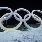 
              Switzerland's Marco Tade takes pictures by the Olympic rings during a training for the men's freestyle moguls skiing competition ahead of the 2022 Winter Olympics, Tuesday, Feb. 1, 2022, in Zhangjiakou, China. (AP Photo/Gregory Bull)
            