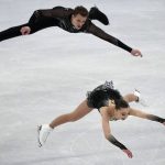
              Aleksandra Boikova and Dmitrii Kozlovskii, of the Russian Olympic Committee, compete in the pairs short program during the figure skating competition at the 2022 Winter Olympics, Friday, Feb. 18, 2022, in Beijing. (AP Photo/David J. Phillip)
            