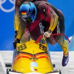
              Francesco Friedrich and Thorsten Margis, of Germany, start the 2-man heat 3 at the 2022 Winter Olympics, Tuesday, Feb. 15, 2022, in the Yanqing district of Beijing. (AP Photo/Dmitri Lovetsky)
            