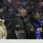 
              Mary J. Blige, from left, watches as Eminem hugs Kendrick Lamar and Dr. Dre as Snoop Dogg, right, gestures after all performed during halftime of the NFL Super Bowl 56 football game between the Los Angeles Rams and the Cincinnati Bengals Sunday, Feb. 13, 2022, in Inglewood, Calif. (AP Photo/Mark J. Terrill)
            