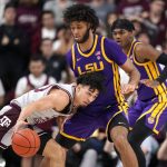 
              Texas A&M guard Andre Gordon (20) tries to drive the lane against LSU center Efton Reid (15) during the first half of an NCAA college basketball game Tuesday, Feb. 8, 2022, in College Station, Texas. (AP Photo/Sam Craft)
            