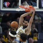 
              Indiana Pacers' Goga Bitadze (88) dunks during the first half of an NBA basketball game against the Minnesota Timberwolves, Sunday, Feb. 13, 2022, in Indianapolis. (AP Photo/Darron Cummings)
            