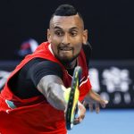 
              FILE - Nick Kyrgios of Australia plays a backhand return to Daniil Medvedev of Russia during their second round match at the Australian Open tennis championships in Melbourne, Australia, Thursday, Jan. 20, 2022. Nick Kyrgios says he had “suicidal thoughts” and dealt with depression and abuse of drugs and alcohol in the past, the latest in a series of high-profile athletes to speak publicly and frankly about their mental health. The 26-year-old Australian wrote in a message posted Thursday, Feb. 24 on his verified Instagram account that he now is “proud to say I’ve completely turned myself around and have a completely different outlook on everything.” (AP Photo/Hamish Blair, File)
            