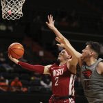 
              Oregon State center Roman Silva tries to block a shot by Washington State guard Tyrell Roberts during the second half of an NCAA college basketball game on Monday, Feb. 28, 2022, in Corvallis, Ore. Washington State won 103-97. (AP Photo/Amanda Loman)
            