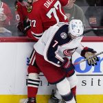 
              Chicago Blackhawks center Kirby Dach (77) and Columbus Blue Jackets center Sean Kuraly battle for the puck during the second period of an NHL hockey game in Chicago, Thursday, Feb. 17, 2022. (AP Photo/Nam Y. Huh)
            
