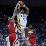
              LSU guard Brandon Murray (0) shoots against Mississippi guard Matthew Murrell (11) during the first half an NCAA college basketball game in Baton Rouge, La., Tuesday, Feb. 1, 2022. (AP Photo/Matthew Hinton)
            