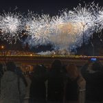 
              A crowd watches as fireworks explode at the opening ceremony of the 2022 Winter Olympics, Friday, Feb. 4, 2022, in Beijing. (AP Photo/Ng Han Guan)
            