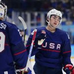 
              United States' Sean Farrell, right, is congratulated by goalkeeper Drew Commesso (29) after Farrell scored a goal against China during a preliminary round men's hockey game at the 2022 Winter Olympics, Thursday, Feb. 10, 2022, in Beijing. (AP Photo/Matt Slocum)
            