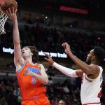 
              Oklahoma City Thunder guard Josh Giddey, left, drives to the basket past Chicago Bulls forward Troy Brown Jr., during the first half of an NBA basketball game in Chicago, Saturday, Feb. 12, 2022. (AP Photo/Nam Y. Huh)
            