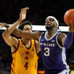 
              Kansas State guard Selton Miguel (3) is fouled by Iowa State forward George Conditt IV (4) while driving to the basket during the second half of an NCAA college basketball game, Saturday, Feb. 12, 2022, in Ames, Iowa. (AP Photo/Charlie Neibergall)
            