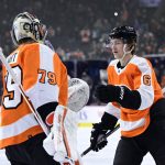 
              Philadelphia Flyers' Travis Sanheim, right, is congratulated by Carter Hart after Sanheim scored a goal during the first period of the team's NHL hockey game against the Detroit Red Wings, Wednesday, Feb. 9, 2022, in Philadelphia. (AP Photo/Derik Hamilton)
            