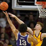 
              Iowa State forward Aljaz Kunc tries to block a shot by Kansas State guard Mark Smith (13) during the first half of an NCAA college basketball game, Saturday, Feb. 12, 2022, in Ames, Iowa. (AP Photo/Charlie Neibergall)
            