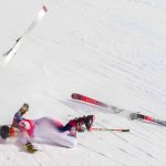 
              Nina O'Brien of United States falls during the women's giant slalom at the 2022 Winter Olympics, Monday, Feb. 7, 2022, in the Yanqing district of Beijing. (AP Photo/Mark Schiefelbein)
            