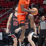 
              Oregon State guard Dashawn Davis (13) goes to the basket as Utah guard Rollie Worster (25) looks on in the first half during an NCAA college basketball game Thursday, Feb. 3, 2022, in Salt Lake City. (AP Photo/Rick Bowmer)
            