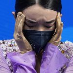 
              Karen Chen, of the United States, reacts after competing in the women's free skate program during the figure skating competition at the 2022 Winter Olympics, Thursday, Feb. 17, 2022, in Beijing. (AP Photo/David J. Phillip)
            