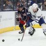 
              Columbus Blue Jackets' Max Domi, left, and Toronto Maple Leafs' Morgan Rielly chase the puck during the second period of an NHL hockey game Tuesday, Feb. 22, 2022, in Columbus, Ohio. (AP Photo/Jay LaPrete)
            