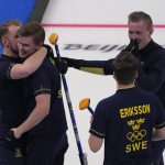 
              Team Sweden celebrates their win during the men's curling final match between Britain and Sweden at the Beijing Winter Olympics Saturday, Feb. 19, 2022, in Beijing. (AP Photo/Nariman El-Mofty)
            