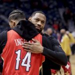 
              New Orleans Pelicans coach Willie Green hugs former player Josh Hart after a win against the Houston Rockets following an NBA basketball game in New Orleans, Tuesday, Feb. 8, 2022. (AP Photo/Derick Hingle)
            