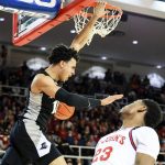 
              Providence forward Justin Minaya (15) dunks as St. John's guard (23) looks on during the first half of an NCAA college basketball game, Tuesday, Feb. 1, 2022, in New York. (AP Photo/Jessie Alcheh)
            